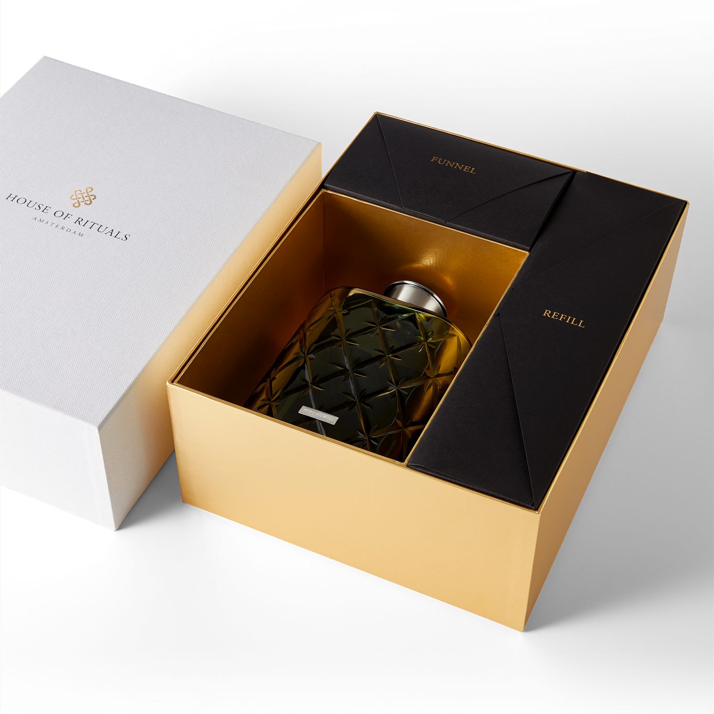 https://rituals.scene7.com/is/image/rituals/1108079_OvalBottlePetrol_premiumpack:Square?resMode=sharp2&wid=1388&hei=1388