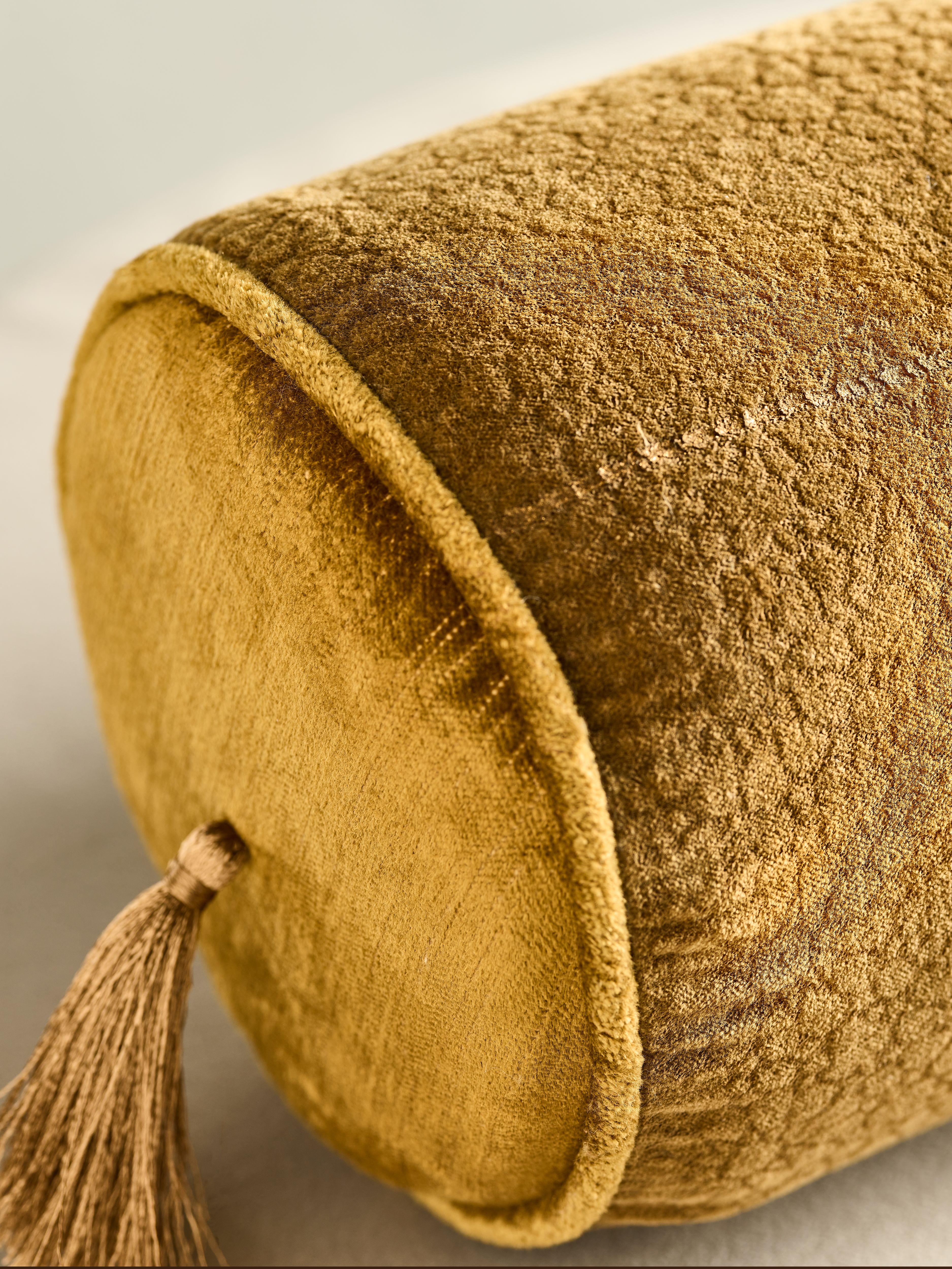 Vellore Cotton Velvet Bolster Cushion Golden Mocha Lifestyle with Product Elements