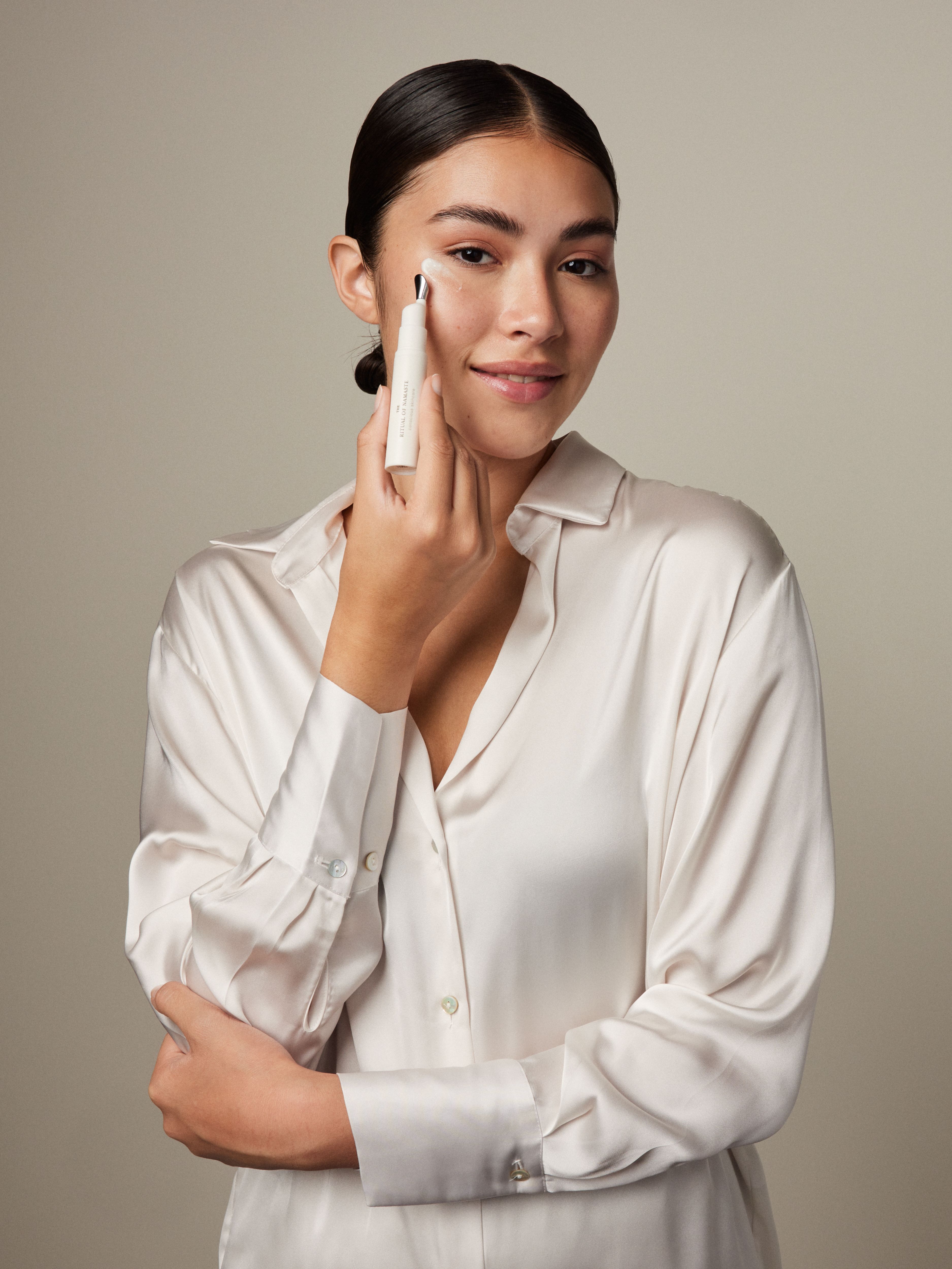 The Ritual of Namaste Cooling Eye Lotion Studio with Model and Product