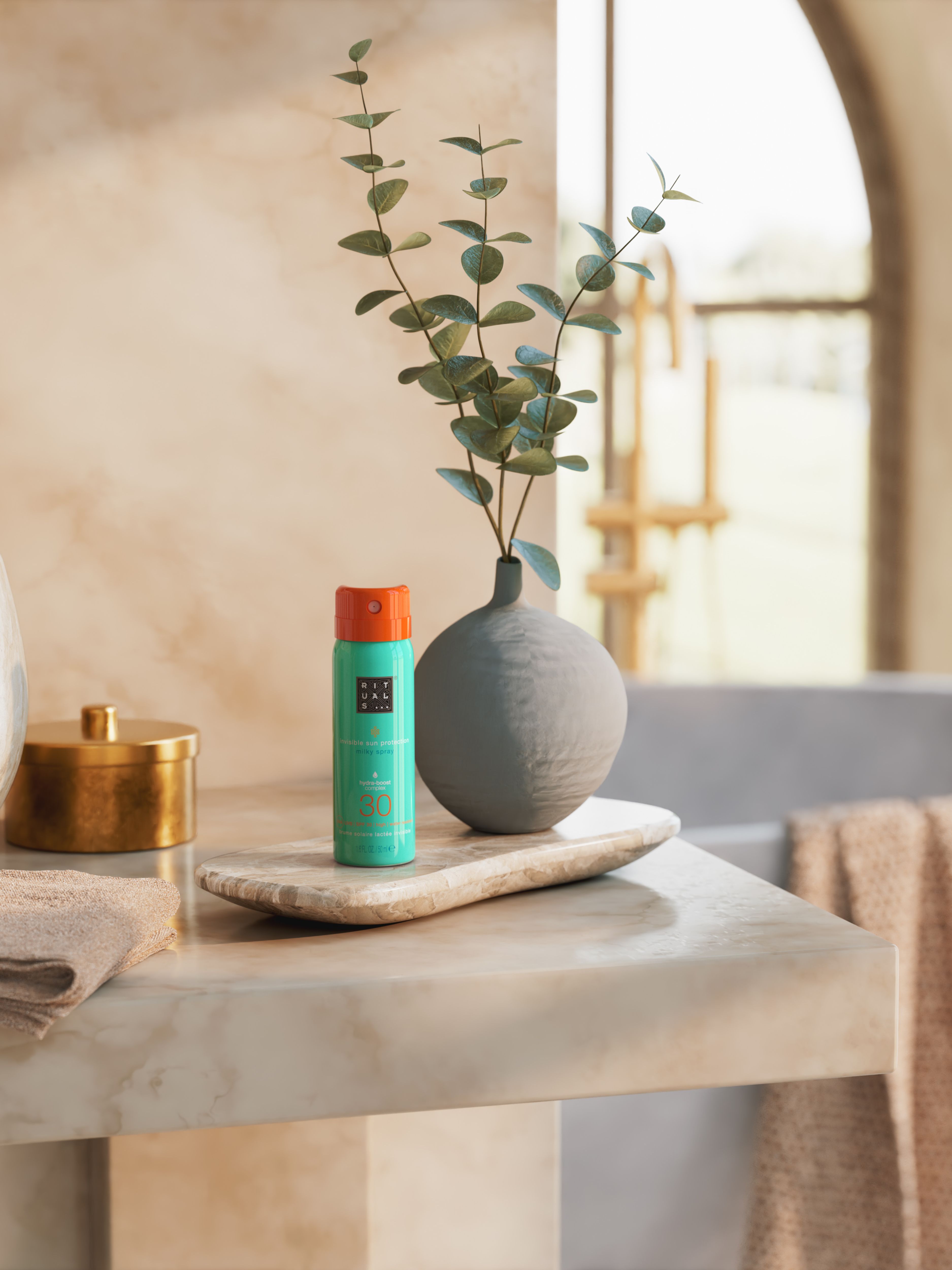 The Ritual of Karma Sun Protection Milky Spray 30 50ml Lifestyle with Product