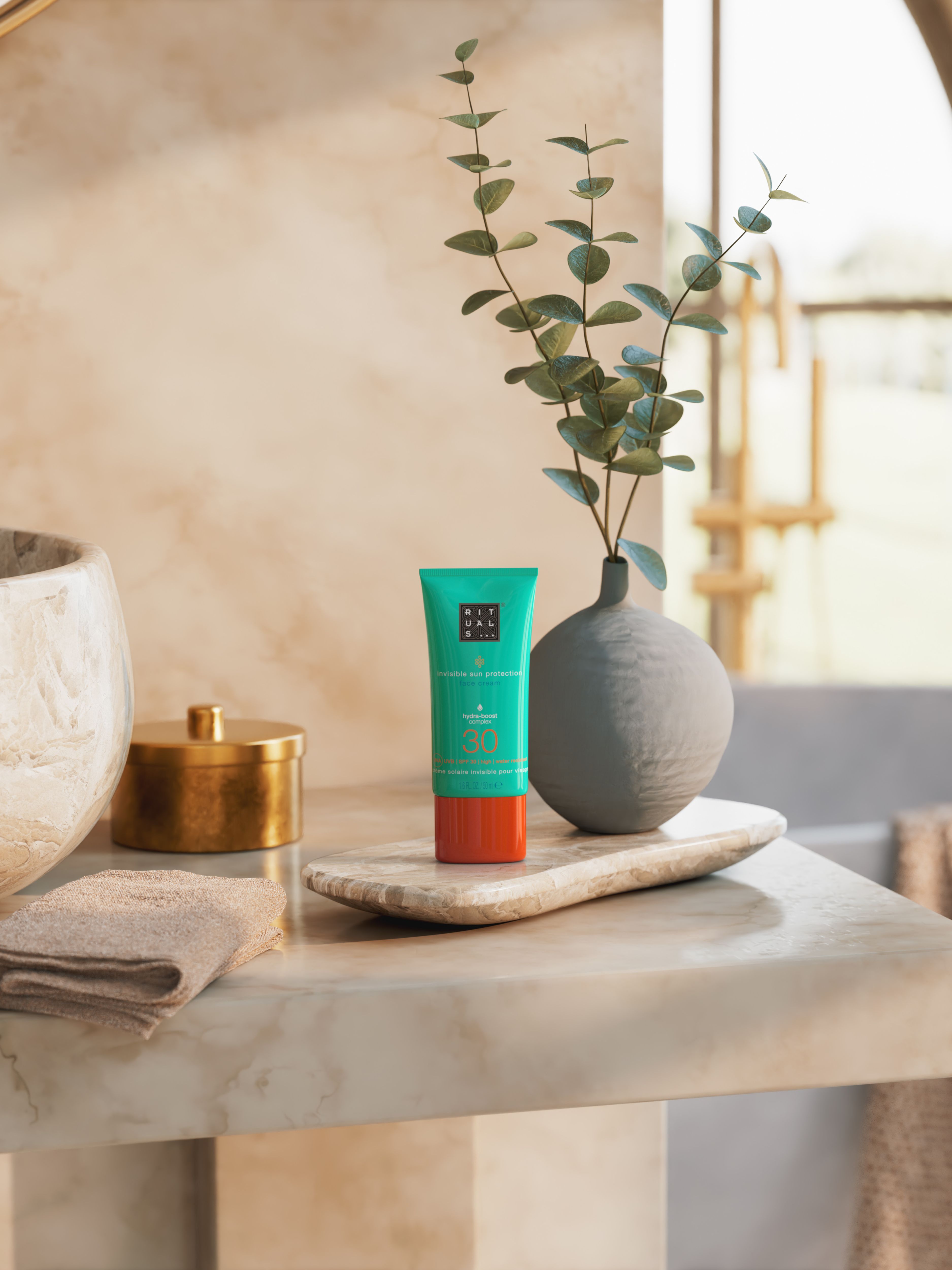 The Ritual of Karma Sun Protection Face Cream 30 Lifestyle with Product