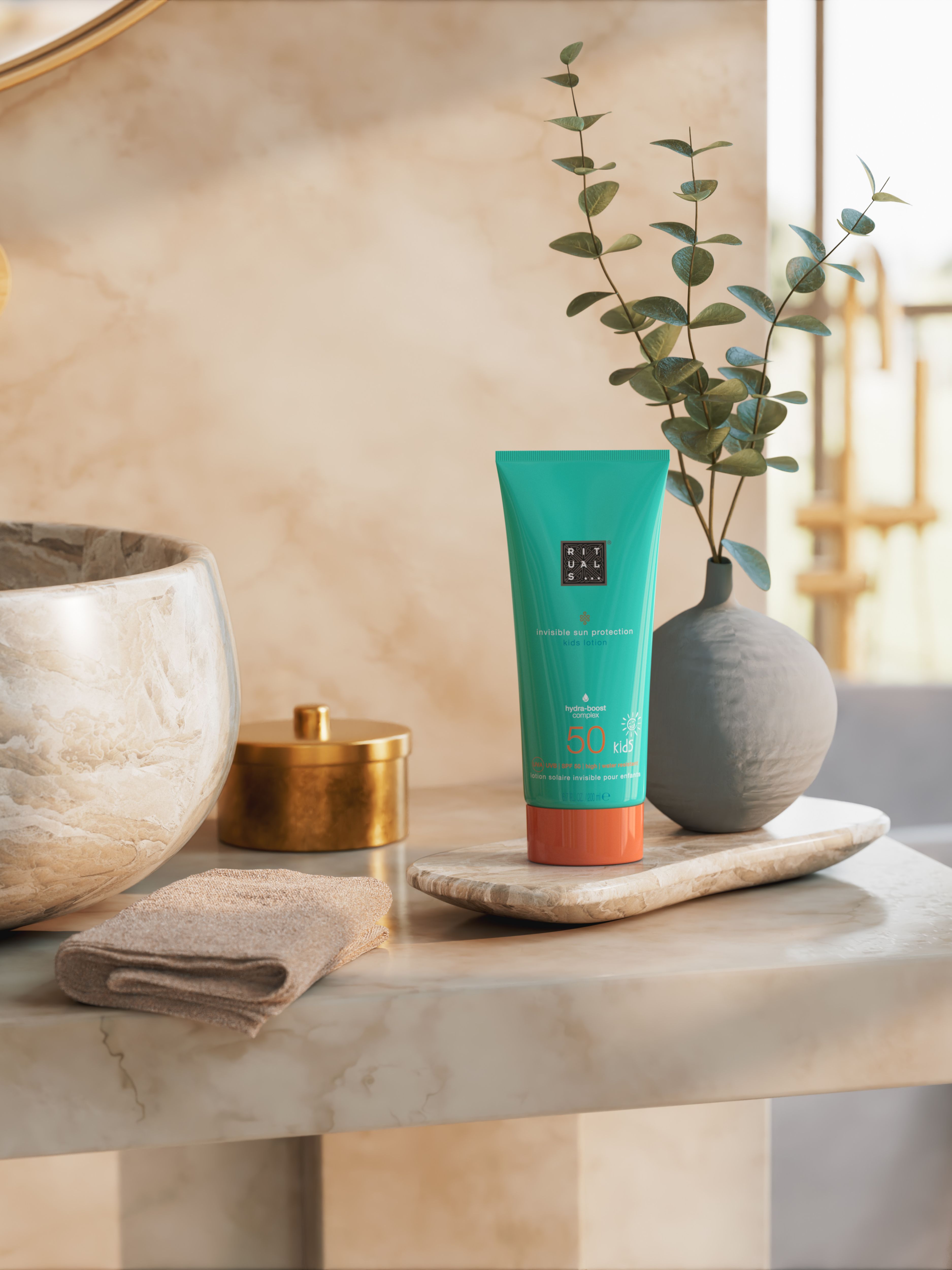 The Ritual of Karma Invisible Sun Protection Kids SPF 50 Lifestyle with Product