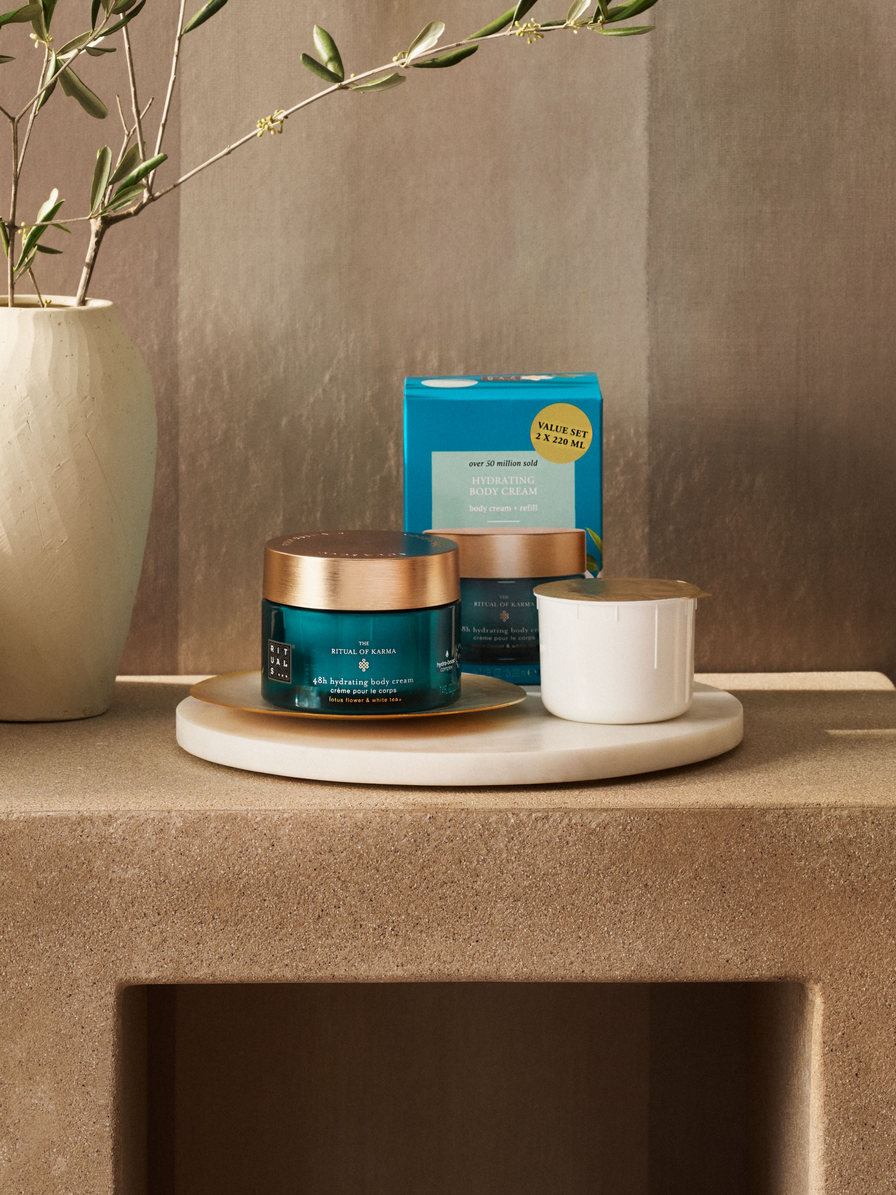 Karma Body Cream + Refill Pack Lifestyle with Closed Pack