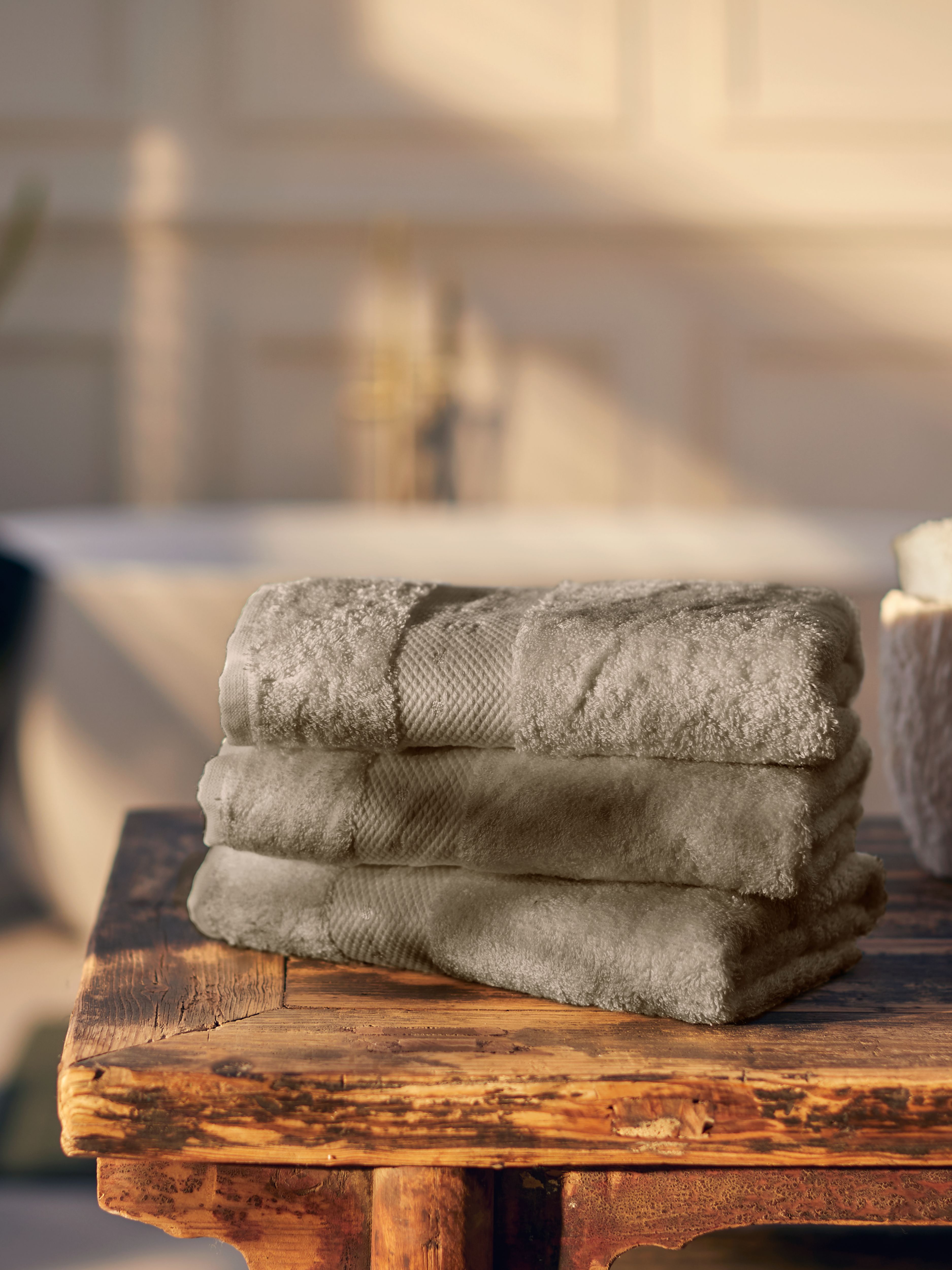 Super Smooth Cotton Hand Towel 50x100cm Sand Lifestyle with Product