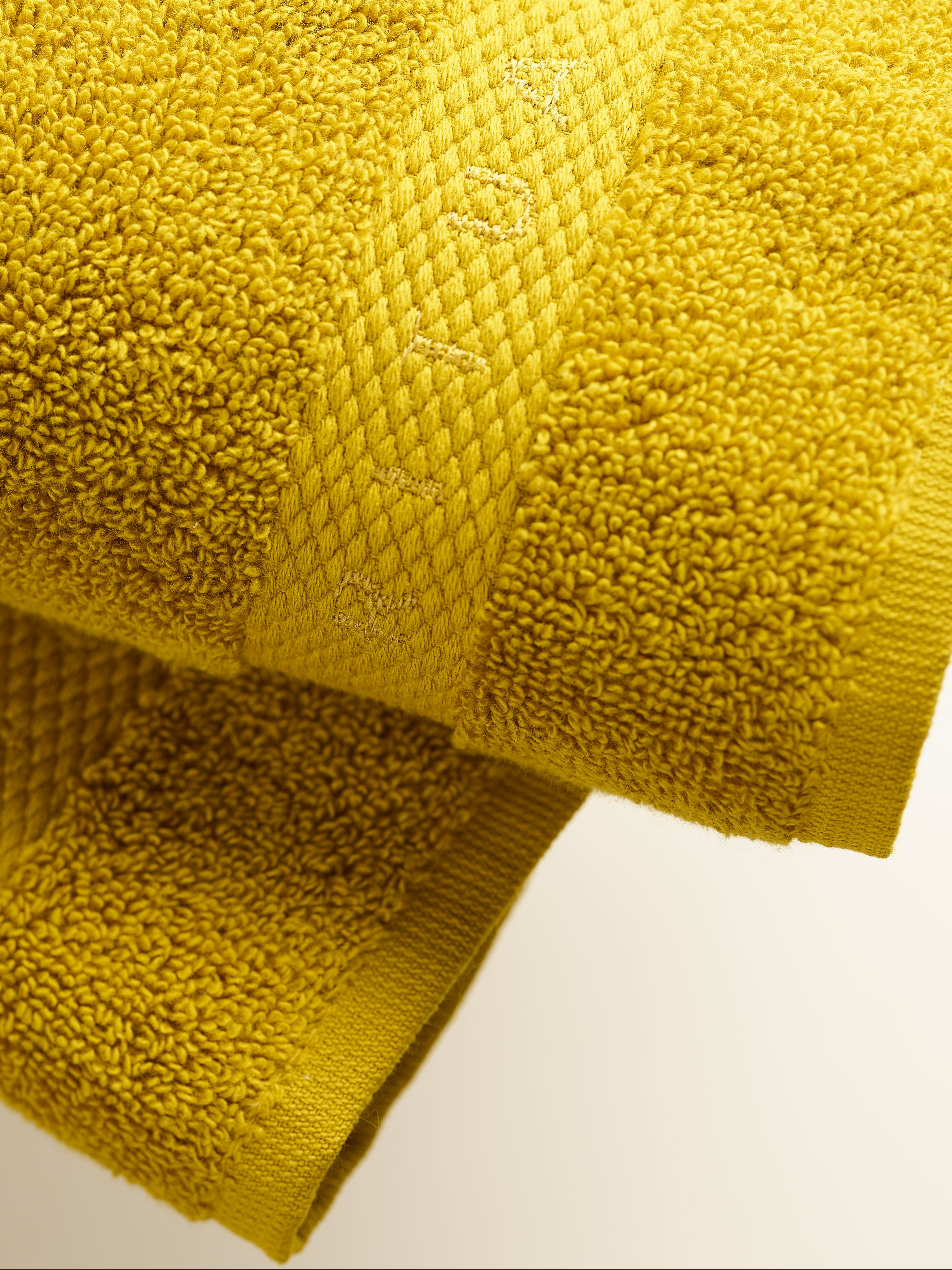 Super Smooth Cotton Guest Towel 30x30cm Mustard Lifestyle with Product Elements