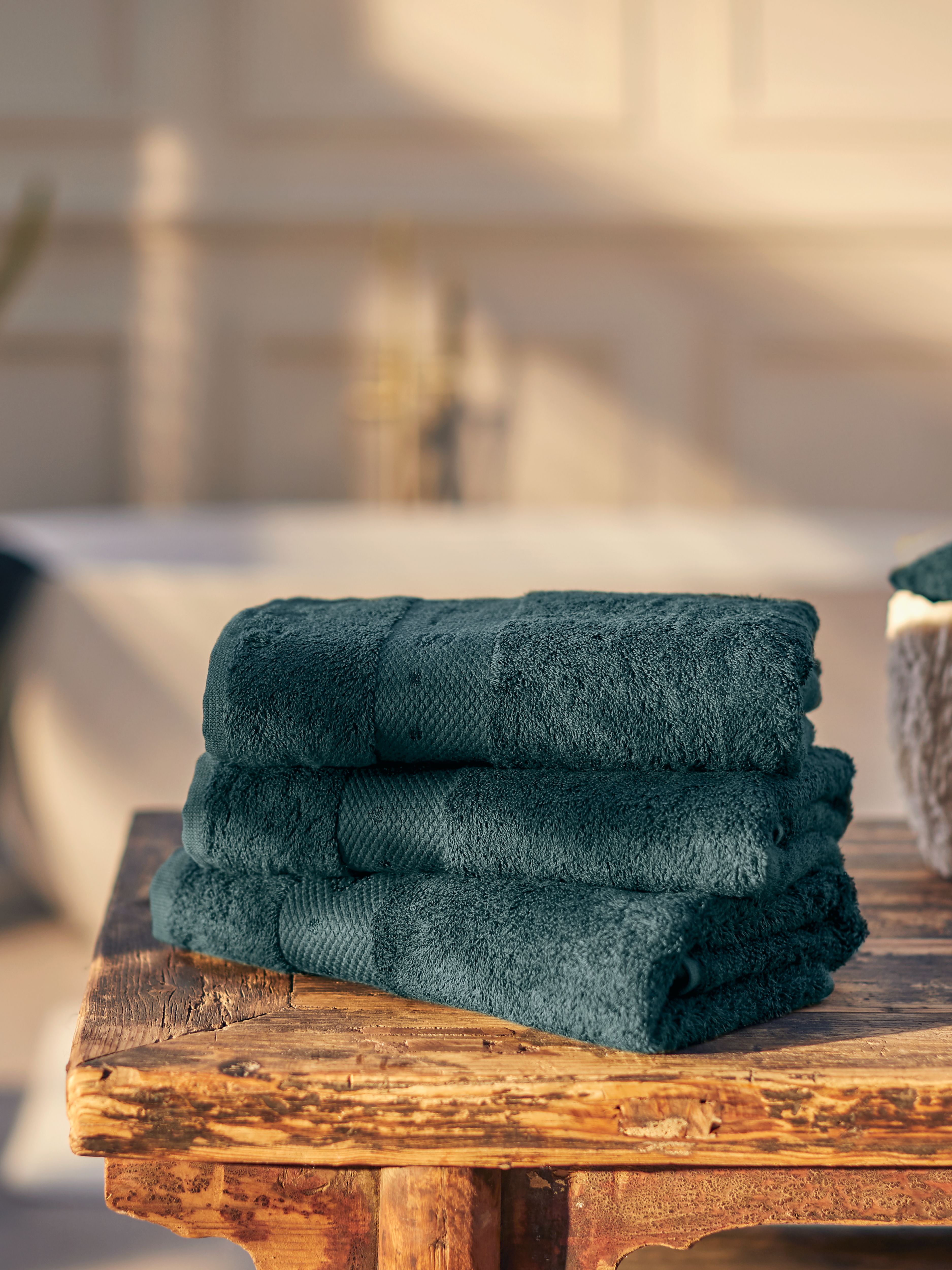 Super Smooth Cotton Hand Towel 50x100cm Petrol Lifestyle with Product