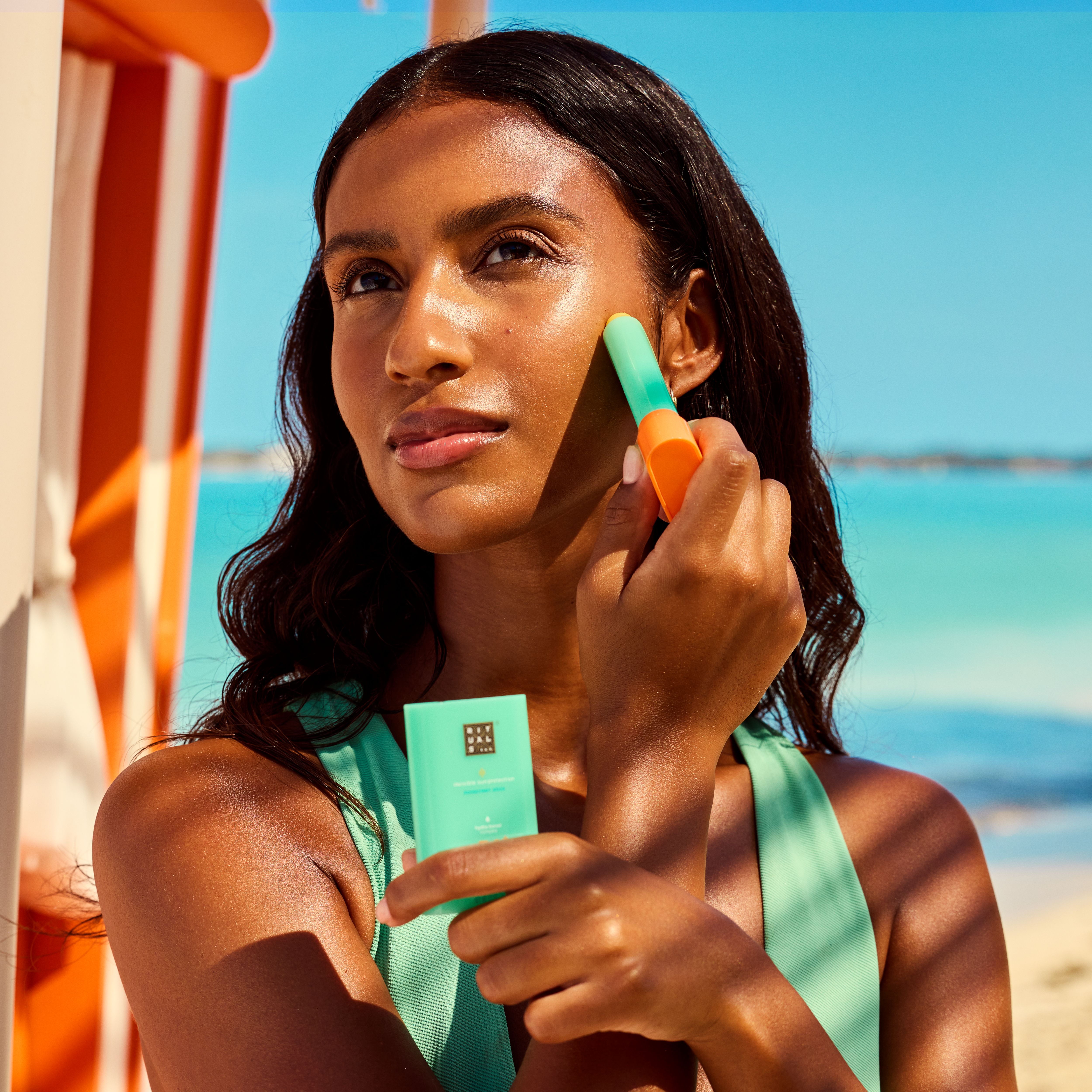The Ritual of Karma Stick Sun Protection SPF 50+ 20g Lifestyle with Model and Packshot