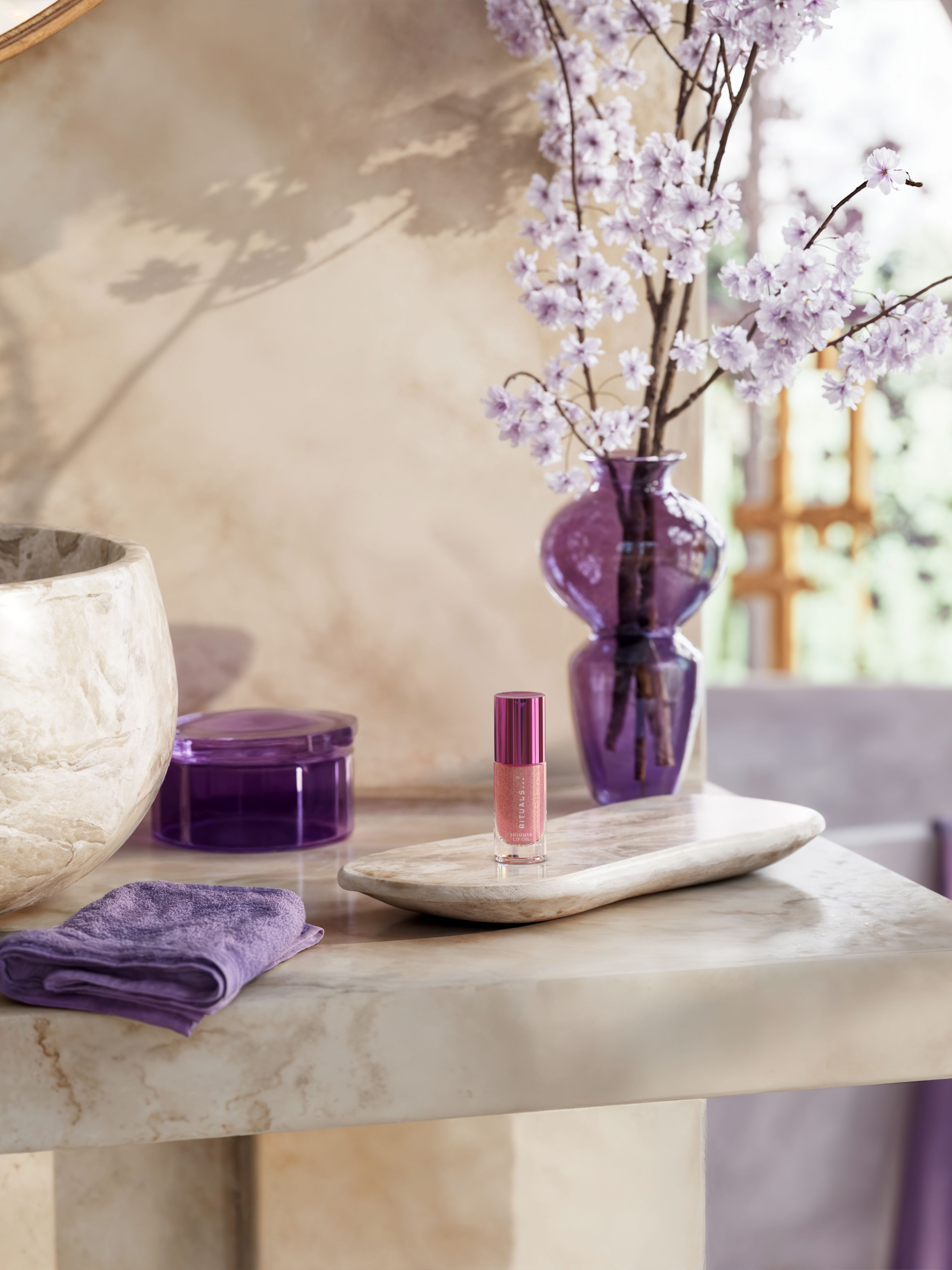 The Ritual of Yozakura Shimmering Lip Oil Lifestyle with Product