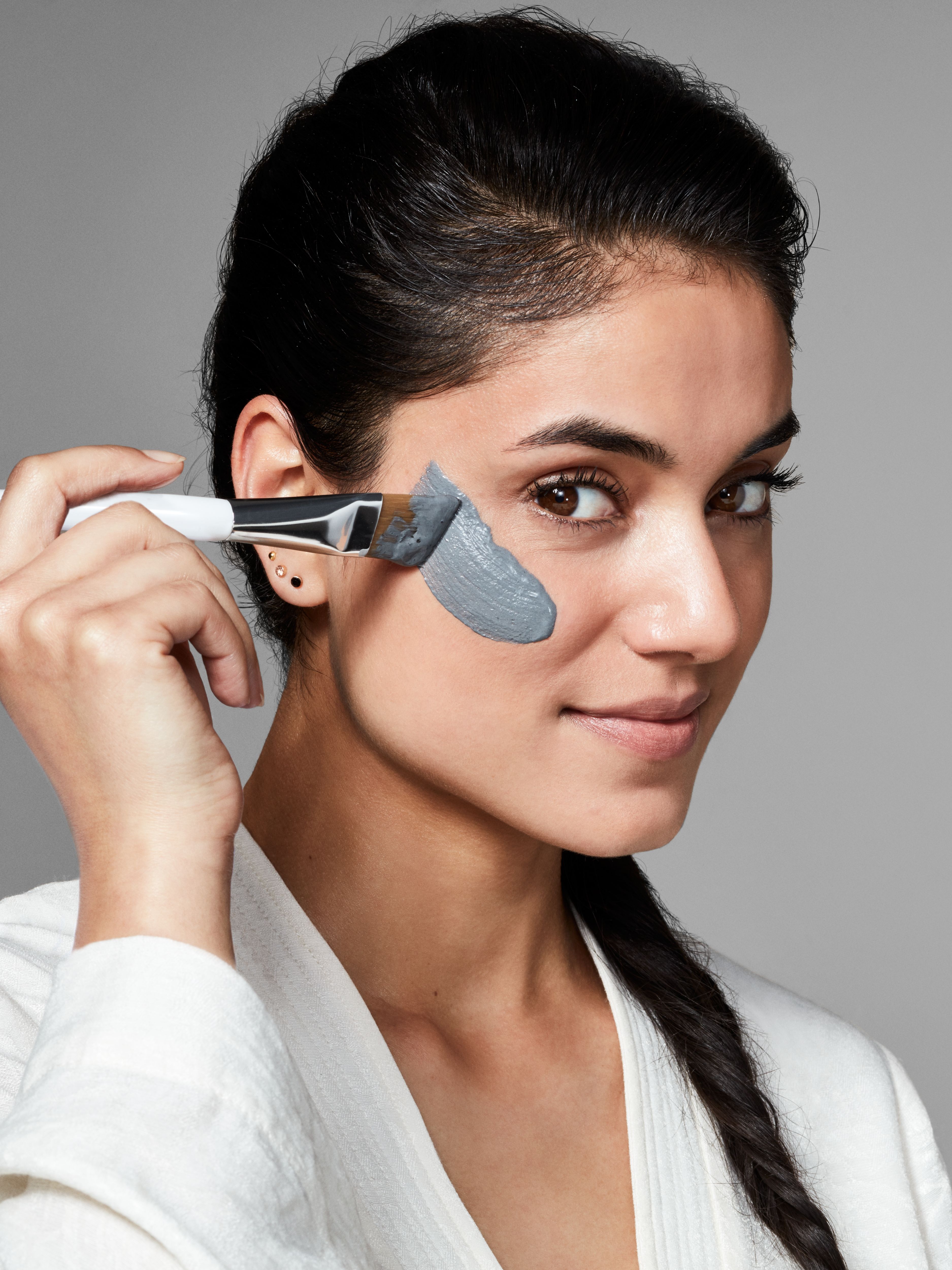 The Ritual of Namaste Purifying Charcoal Wonder Mask Studio with Model and Product