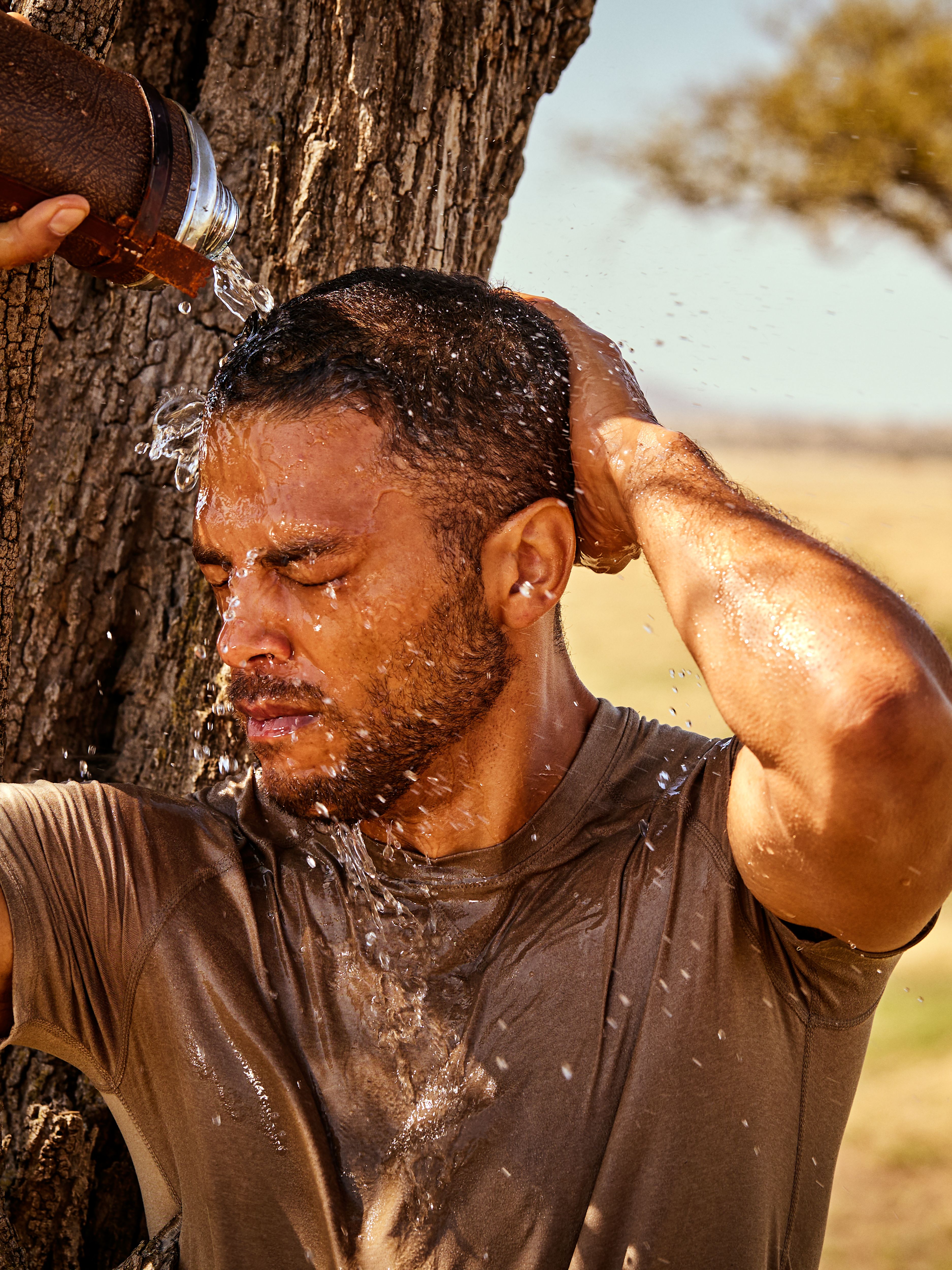 Homme Strengthening Caffeine Shampoo 70ml Lifestyle with Model and Packshot