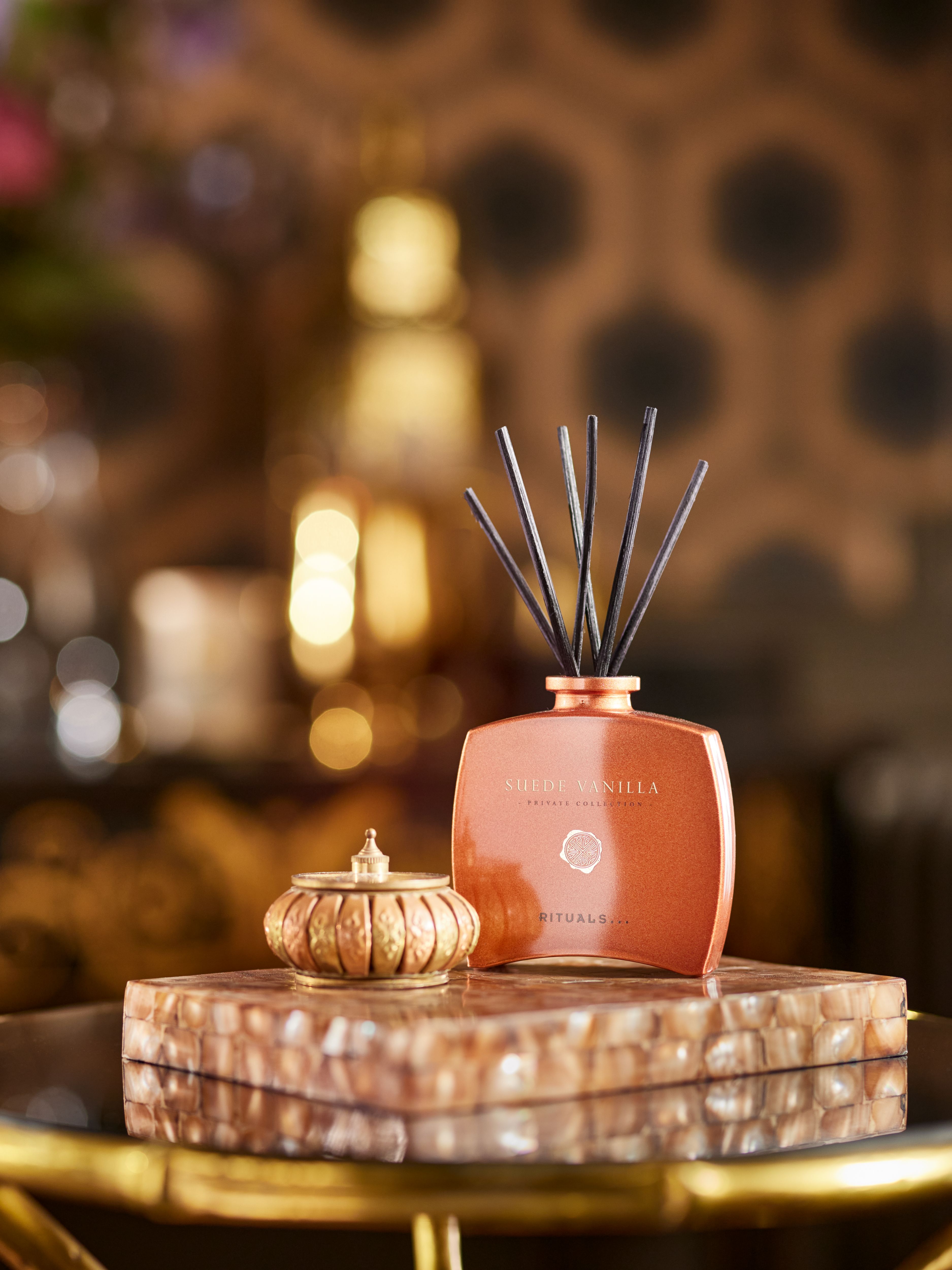 Suede Vanilla Mini Fragrance Sticks Lifestyle with Product